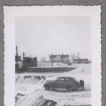 Unidentified view, man with car, 1948