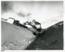 Steam dredge in operation loading cars on banks of Truckee canal, Truckee-Carson Reclamation Project