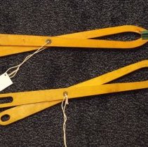 Two wooden grippers by Davison Company