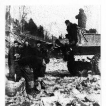 Placing fill on dam.