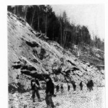 Placing fill on dam.