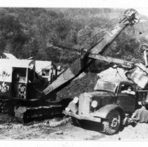 Placing fill on dam.