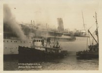 S.S. City of Honolulu on fire in Honolulu Harbor May 25, 1930