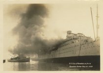S.S. City of Honolulu on fire in Honolulu Harbor May 25, 1930