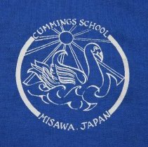 Polo shirt, short-sleeved: blue, with white lettering. "Cummings School - Misawa, Japan."