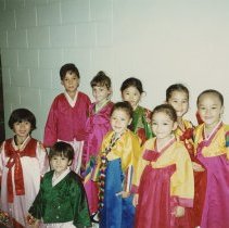 Color. Chusok Korean Thanksgiving. Osan Elementary. (3) Children in traditional attire.
