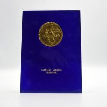 Overseas Schools Champions Blue with Gold emblem.