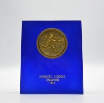 Overseas Schools Champion 1983. Tennis. Blue with gold emblem.