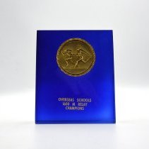 Overseas Schools 1600 M Relay Champions. Blue with gold emblem.