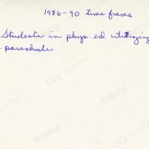 1986-1990. Students in physical education utilizing a parachute