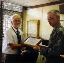 Colonel David K Osborn presents Commander's Award for Civilian Service to John Blom