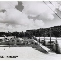 Camp Kue Primary. School buildings and children/teachers outside 1968
