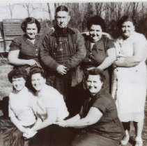 Phil Bennett and girls! Left to right: Ruth, Phil, Eunice, Ila Mae. Front l