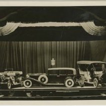 (115) Display of 1909, 192 Auburn and 1929 Cord on Stage, Court Theatre