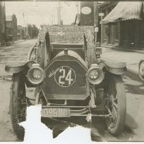(90) 1911 Auburn Front View, Interlock Inner Tires Advertisement on Car