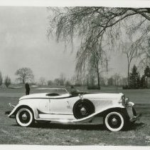 1932 Auburn 12-160 Speedster on Golf Course with Players, Right Profile