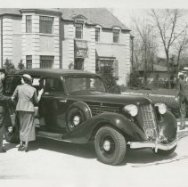 (621) 1935 Auburn 851 Landau, Man, Woman, and Driver, 3/4 Right Front View