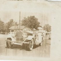 (298) 1928 Auburn 8-115 Speedster in Parade, Texaco Sign in Background