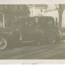 (355) 1929 Auburn Sedan in Residential Area with Woman Beside and Driving