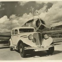 (589) 1934 850 Auburn Sedan with a Vultee Transport Plane