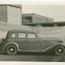 (599) 1934 850 Sedan in Front of Canvas Tarp, Passenger Side Profile