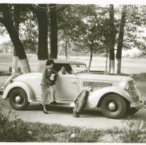 (647) 1935 Auburn 6 Cylinder Cabriolet with Two Women, a Set of Golf Clubs