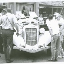 (708) 1935 Auburn with a Number of Men Gathered Around at a Car Show