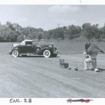 (837) 1936 Auburn 852 Cabriolet Being Photographed in a Grassy Setting