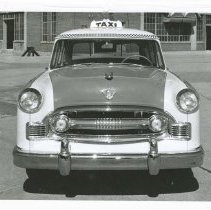 (931) 1955 Checker Cab Full Front View, Factory Building in Background
