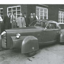 (950) 1947 Tasco Prototype with Two Passengers and Seven Men Looking On