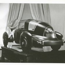 (979) 1948 Tasco Scale Model on a Stand in an Office