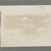 (105) 1903 Cadillac Runabout in Front of the Penry Brothers Hardware