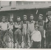 (250) AAC Employees Employees in Front of a Factory Building