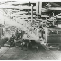 (273) AAC Employees Working on the Cabs on the Assembly Line