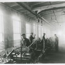 (282) AAC Employees Working on the Engine Assembly Line