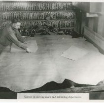 (317) AAC Employee Cutting a Piece of Upholstery