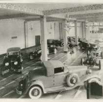 (351) North Showroom of Admin Building with Many Autos in Shot