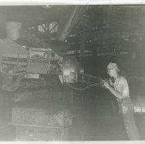 (466) A Lycoming Employee Working a Machine in Factory, Williamsport,PA
