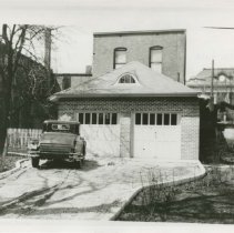 (550) Car at Garage of McIntyre Home, Corner of S. Main and E. 14th Street,