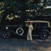 (118) 1929 Cord L-29, left profile, with a woman grasping driver side door