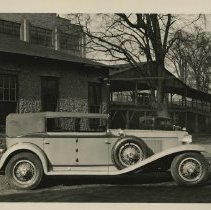 (136) 1929 Cord L-29 Phaeton Sedan on the grounds of the AAC Complex