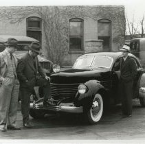 (418) 1936 Cord 810 Westchester Sedan, three AAC executives inspecting car