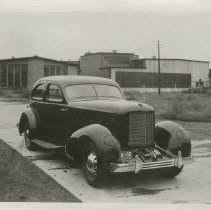 (534)1937 Cord 810 LeBaron custom limousine on a factory grounds