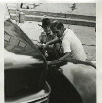 (559) Two men looking at a 1936 Cord 810 at the 1975 ACD Club Reunion
