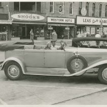 (114)1930 Duesenberg J-288 Car2307 Convertible Sedan man and women, 7th St.