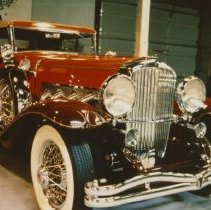 (149)1930 Duesenberg J-338 Car2350 Convertible Berline, with many trees beh