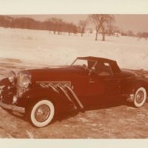 (22)1980 Duesenberg II replica of J-102E, in a snowy rural setting