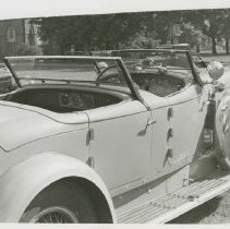 (227)1933 Duesenberg J-526 Car2554 Torpedo Phaeton, church in distance