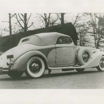 (69) 1933 Duesenberg J Convertible Victoria, large barn in background