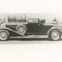 (396)1929 Duesenberg J-137 Car 2162 Town Car, left profile, brick building